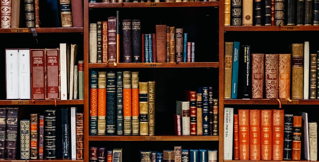 assorted-title of books piled in the shelves