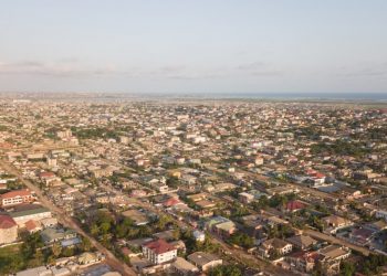 an aerial view of a city with lots of houses