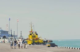 yellow and black heavy equipment on dock during daytime