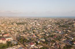 an aerial view of a city with lots of houses